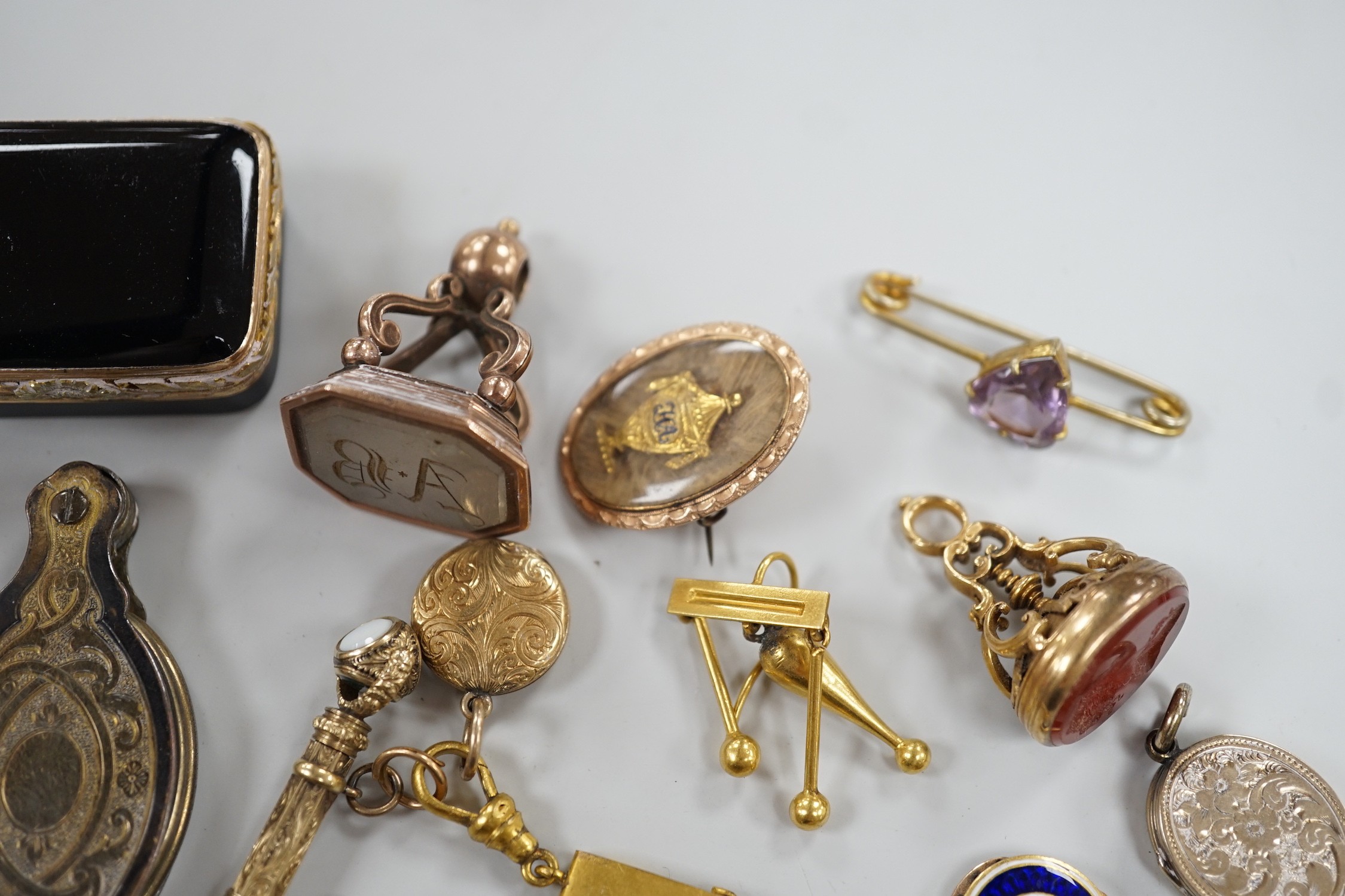 Mixed collectables including a yellow metal clam shell mourning pendant, 22mm, a George III yellow metal and plaited hair mourning brooch, with central urn and engraved inscription verso, three assorted 19th century and